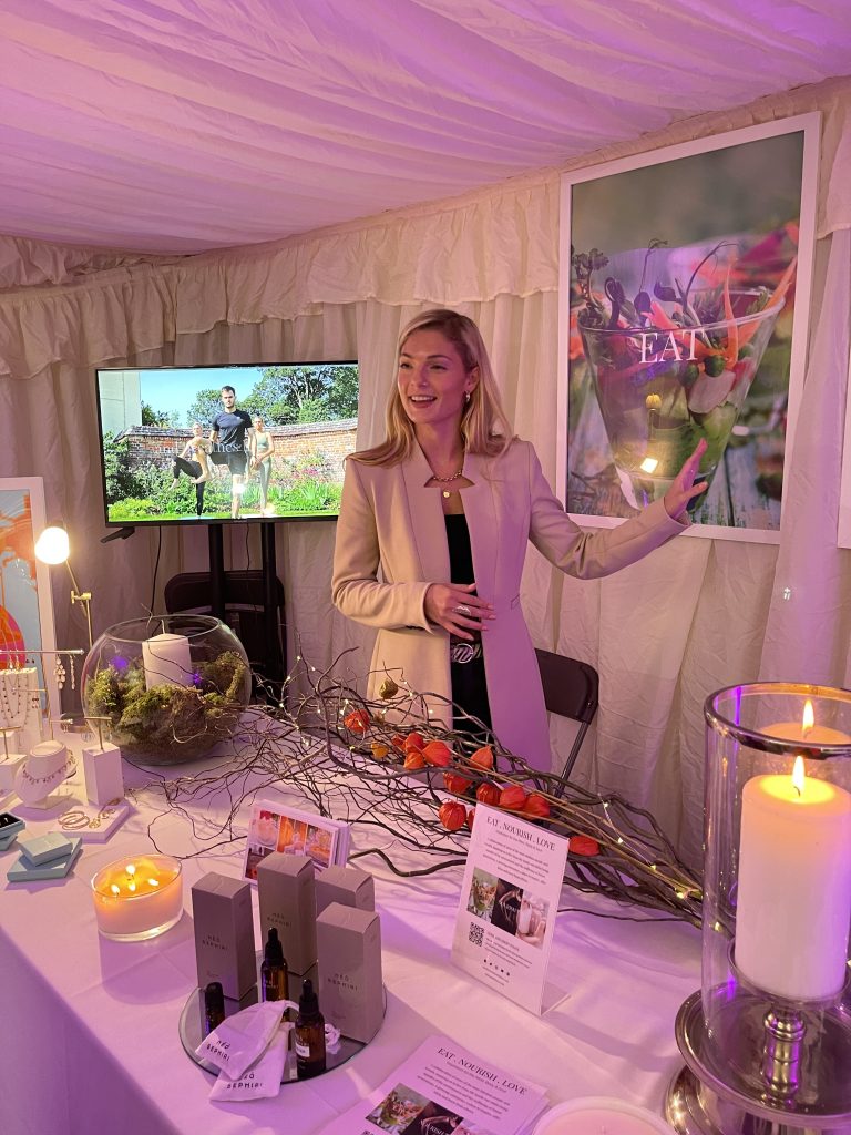 Caroline Cary presenting the Eat Nourish Love Collective brand at a live event showcase